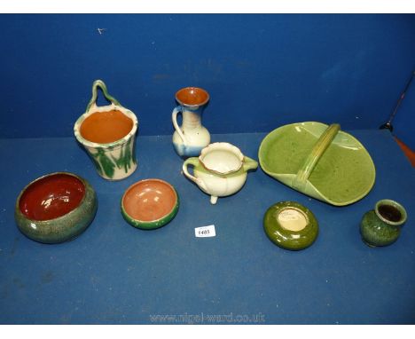 A quantity of Ewenny Pottery including; a basket, bud vases, bowls, etc. Along with three, unmarked but in Ewenny style, item