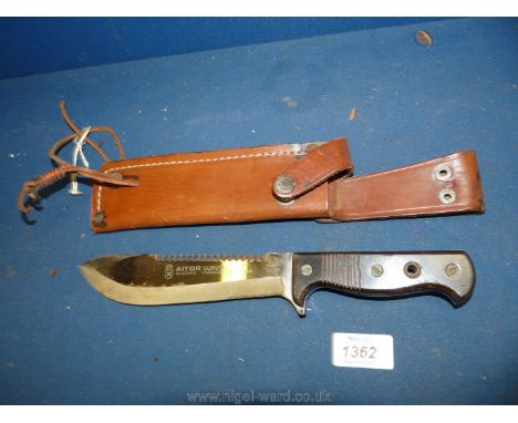 A 1970 survival knife issued to the South African army in a brown leather case, 7" long.