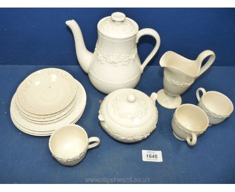 A Wedgwood Queens ware cream coloured part coffee service, date stamps for 1930's, three cups four saucers