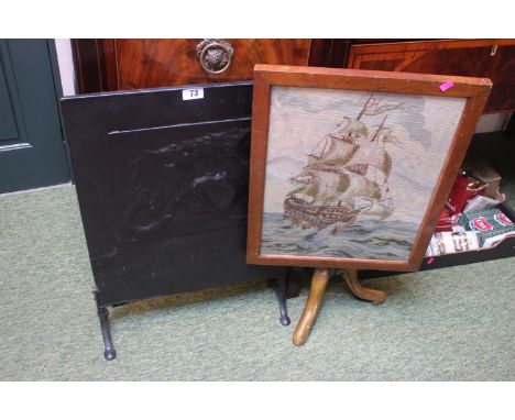 Metal embossed fire screen with Dragon decoration and a Wooden framed fire screen with Galleon decoration 