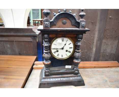 A late 19th or early 20th Century stained frame mantel clock