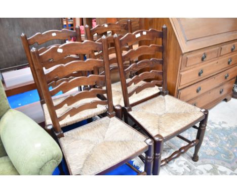A set of four oak ladder back dining chairs having rush seats.
All four chairs in very good condition.
Chairs are similar to 