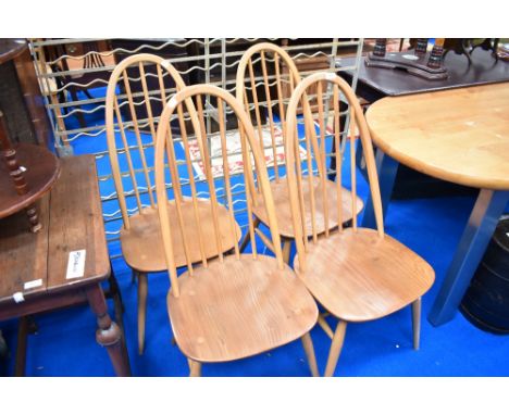 A set of four Ercol high back kitchen dining chairs.
light wear to frame but sound with no damage.