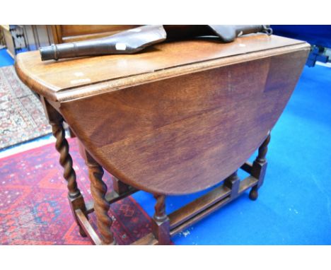 An oak twist gate leg dining table