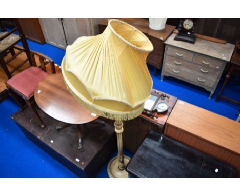 A traditional French style standard lamp with period shade