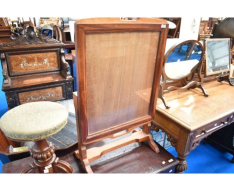 A traditional mahogany framed fire screen/table having tilt top