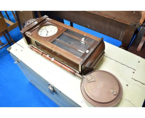 An early 20th Century mahogany cased wall clock and traditional copper warming pan