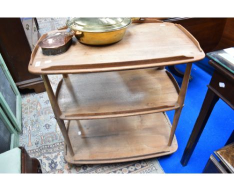 A light Ercol tea trolley, on shepherds castors