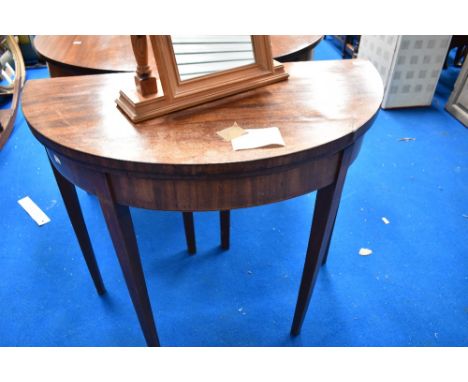 A 19th Century mahogany demi lune fold over card table