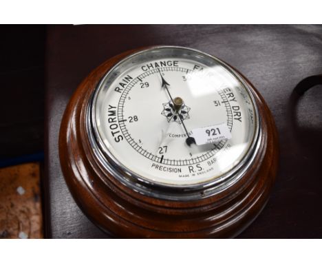 A vintage mahogany framed aneroid barometer