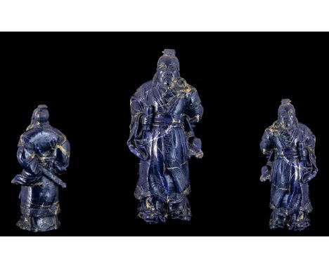 Antique Chinese Large Carved Lapis Lazuli Figure depicting a Chinese deity, dressed in fine robes and holding a scroll; 9.5 i