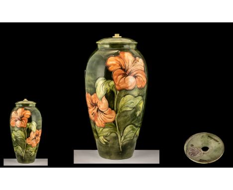 Large Moorcroft Hibiscus Pattern Lamp Base on a Green Body Ground, Impressed Mark - Moorcroft with Paper Label Potters to the