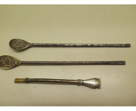A pair of Chinese silver and gilt tea infusers decorated with chrysanthemum together with a Russian infuser with a gold mouth