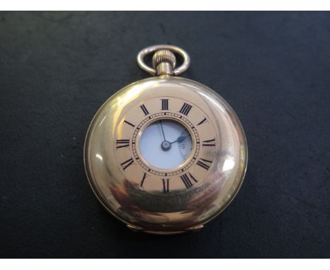 An 18ct yellow gold half hunter pocket watch marked 18K with an engraved back and 18ct gold dust cover in good condition, run