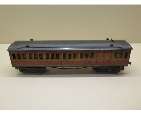 A Hornby 0 gauge tinplate 1920s Metropolitan Line 3rd class Brake Coach with lighting, reasonably good condition, missing one
