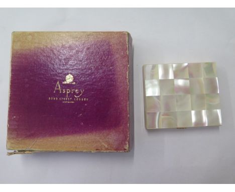 A mother of pearl compact made in Switzerland, 8cm x 7cm, in good condition in an Asprey box (worn) 