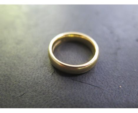 A hallmarked 22ct yellow gold band ring, size J/K, approx 7.3 grams, some usage marks otherwise good 