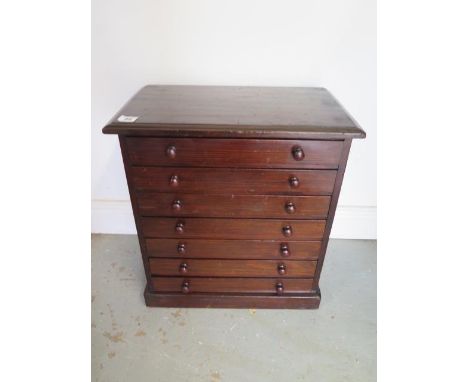 A seven drawer mahogany collectors cabinet, 51cm tall x 45cm x 27cm 