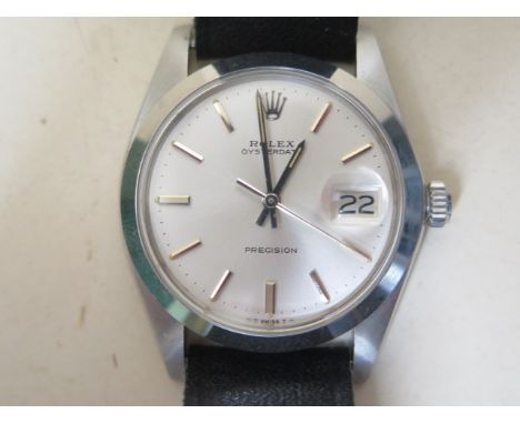 A gents Rolex Oysterdate Precision manual wind stainless steel wristwatch, model 6694 case number 3818706, 36mm case on a pla