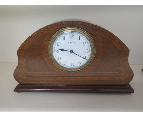 An 8 day French mantle clock mahogany case with boxwood inlay, 17cm tall, case good, running, dial good 