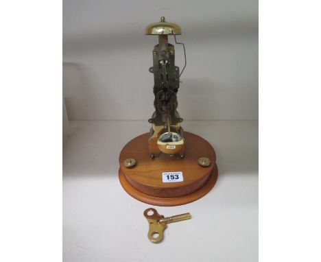 A Franz Hermie skeleton type mantle clock striking on a bell, 26cm tall with key, running order, missing dome 