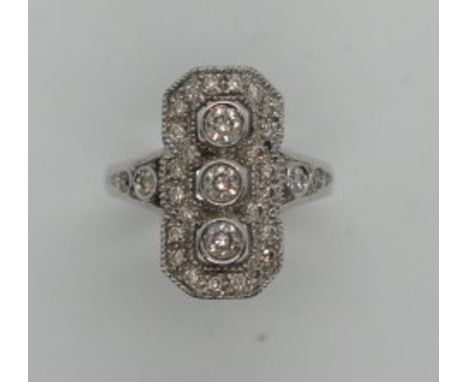 An 18ct white gold Art Deco vintage style diamond ring, size approx P, marked 750, head approx 20mm x 10mm, in good condition