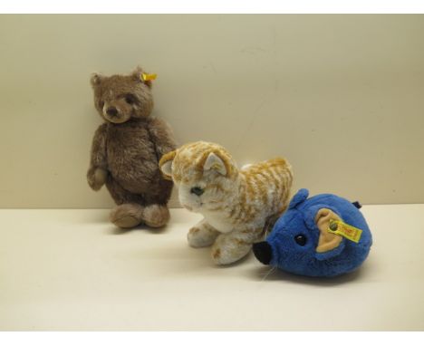 Three Steiff toys; a Steiff cosy felt blue mouse 5390/15, button and label intact; a Steiff small teddy 002205 (Knopf im ohr)