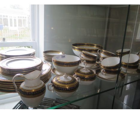 A Royal Crown Derby blue and gilt dinner tea service with 12 cups and saucers, 12 tea plates, 6 side dishes, 2 bowls, a jug a