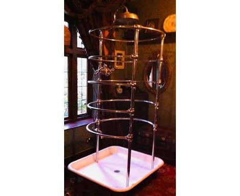 A Victorian, needle or ribcage (rib cage) shower of typical form, the cast iron and enamelled  base on ball and claw supports