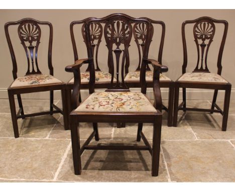 A set of five mahogany Hepplewhite style dining chairs, early 20th century, each with an openwork urn design splat back, over