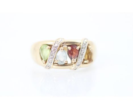 A 9ct yellow gold dress ring, the ring set with peridot, aquamarine, garnet and citrine with two lines of round cut diamonds,