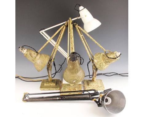 Three Herbert Terry & Sons Anglepoise lamps, early 20th century, each of typical form in a green marbled colourway, upon step