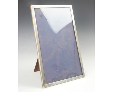 A George V silver mounted photograph frame, A &amp; J Zimmerman Ltd, Birmingham 1927, of large proportions, the plain polishe