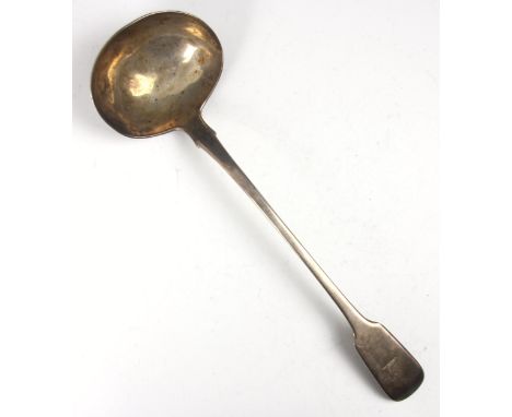 A George IV silver fiddle pattern soup ladle, William M Traies, London 1825, of typical form with crest depicting unicorn, po