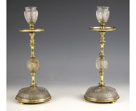 A pair of F & C Osler cut glass and gilt brass candlesticks, 20th century, each with diamond cut glass decoration throughout,