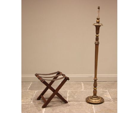 A mahogany 'X' frame folding luggage stand, early 20th century, applied with three leather retaining straps, 46cm H x 46cm W 