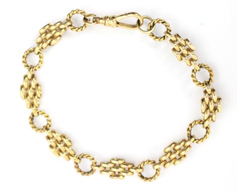 A yellow metal fancy gate link bracelet, the lozenge shaped brick links interspersed with rope twist circular links, with lob