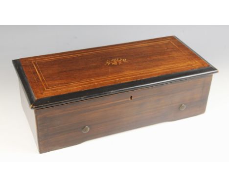 A rosewood cylinder music box, late 19th century, the case with marquetry musical motif and boxwood banding to the hinged cov