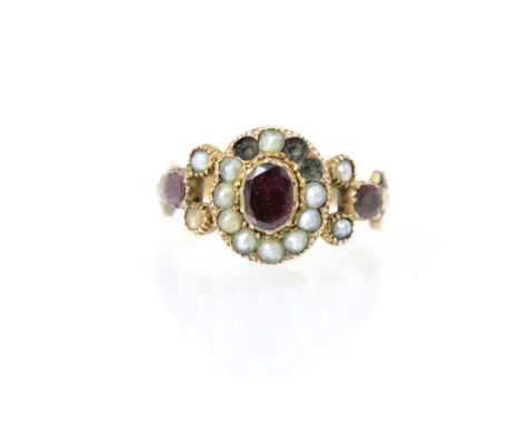 A 19th century split pearl and red stone ring, the red stone centre (possibly foil backed) with surround of split pearls and 