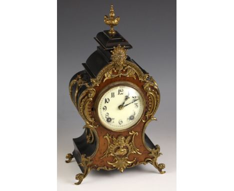 A German burr veneer and ebonised mantel clock, in the Rococo style, by Lenzkirch, late 19th/early 20th century, applied with