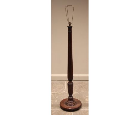 A Regency style mahogany standard lamp, early 20th century, the tapering acanthus moulded column extending to a turned collar