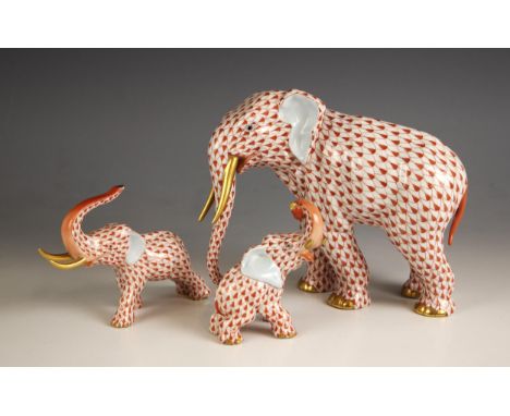 A Herend porcelain elephant of large proportions, 20th century, with red fishnet decoration throughout, gilt highlights throu