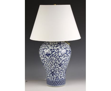 A Ralph Lauren blue and white Chinese influence lamp vase, of baluster form, applied with scrolling foliate detail, complete 