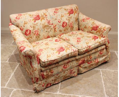 A two seater sofa, late 19th/early 20th century, of cottage proportions, later re-covered in floral fabric, the sprung back r