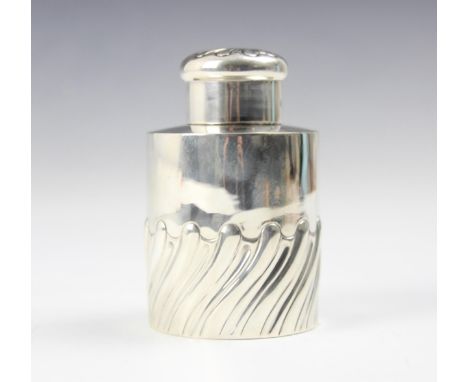 An Edwardian silver tea caddy, S W Smith &amp; Co, London 1901, the pull off cover with embossed swirl detail above a cylindr