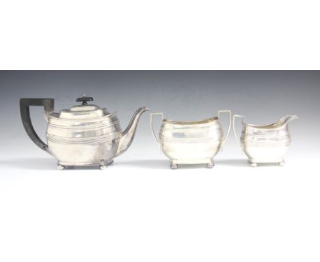 A George V silver three piece tea service, Harrison Brothers and Howson, Sheffield 1927, comprising a teapot, twin handle sug