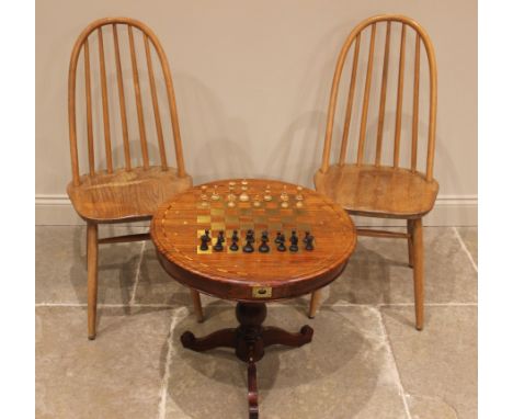 A brass inlaid hardwood pedestal chess table, late 20th century, the circular moulded top inlaid with a brass chequered board