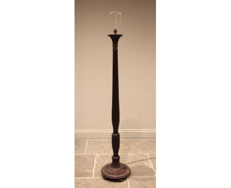 A Regency style mahogany standard lamp, early 20th century, the reeded acanthus column extending to a bat wing carved collar 