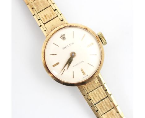 A ladies 9ct yellow gold Rolex Precision wristwatch, the circular white dial with baton markers, set to a plain polished case