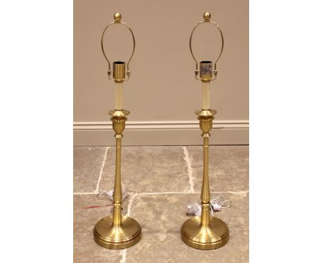 A pair of Ralph Lauren lacquered brass table lamps, modelled in the form of 19th century candlesticks, complete with blue and